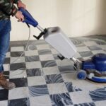 5f181d3bb9515debfc2cde1c_Cleaning---Dirty-B&W-Tiles-with-Machine-and-Operator